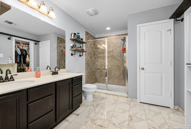 full bathroom featuring toilet, marble finish floor, a sink, and visible vents