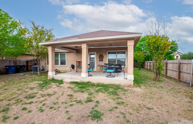 back of property featuring cooling unit, a fenced backyard, and a patio area