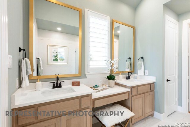 349 Hulda, New Braunfels, TX 78130 - bathroom featuring double vanity, a sink, and marble finish floor