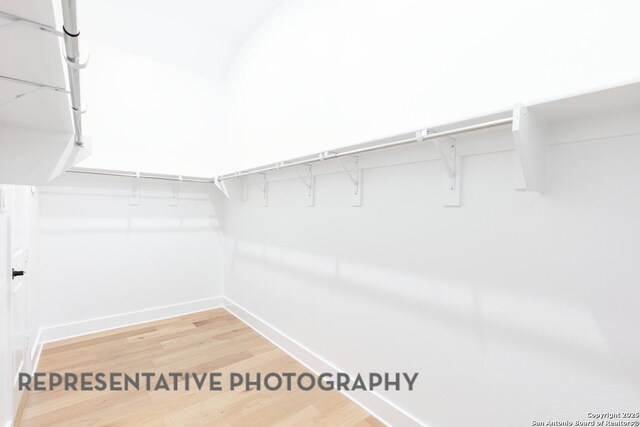 349 Hulda, New Braunfels, TX 78130 - walk in closet featuring light wood-type flooring