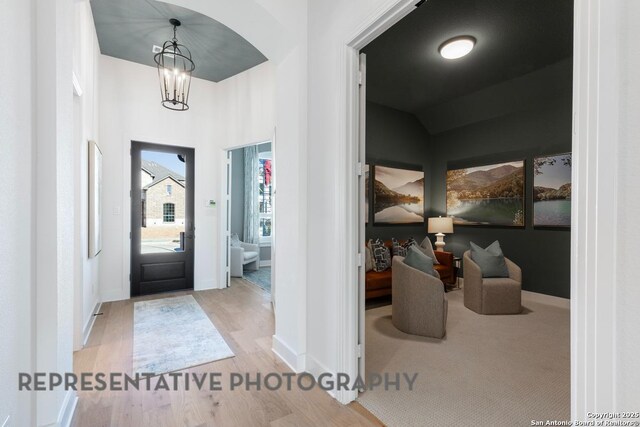 349 Hulda, New Braunfels, TX 78130 - entryway featuring a notable chandelier, wood finished floors, and baseboards
