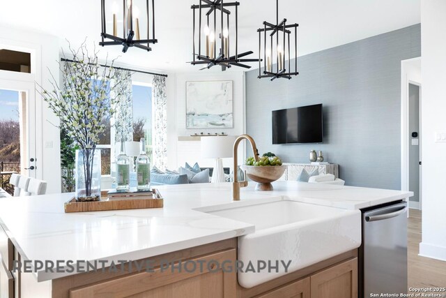 349 Hulda, New Braunfels, TX 78130 - kitchen with open floor plan, light wood-style floors, a notable chandelier, and a sink
