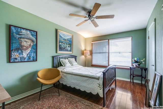 bedroom featuring wood-type flooring, a ceiling fan, and baseboards