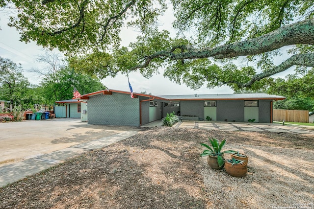 single story home with fence and brick siding