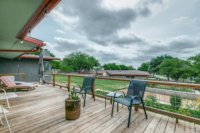 deck featuring a lawn