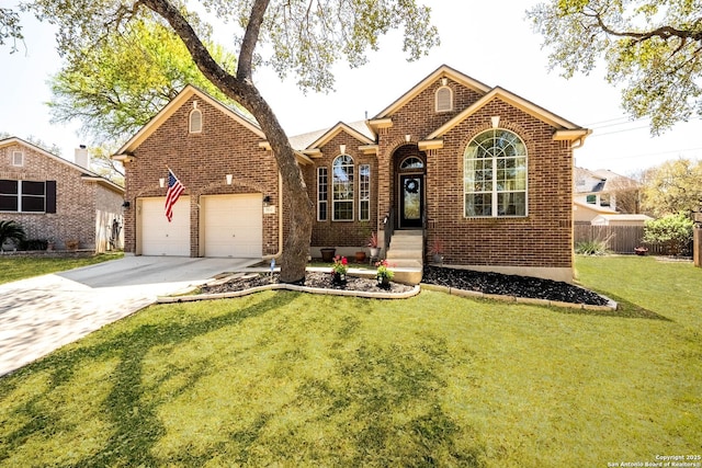 view of front of property featuring a front lawn, a garage, driveway, brick siding, and fence