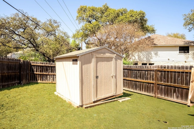 view of shed featuring a fenced backyard