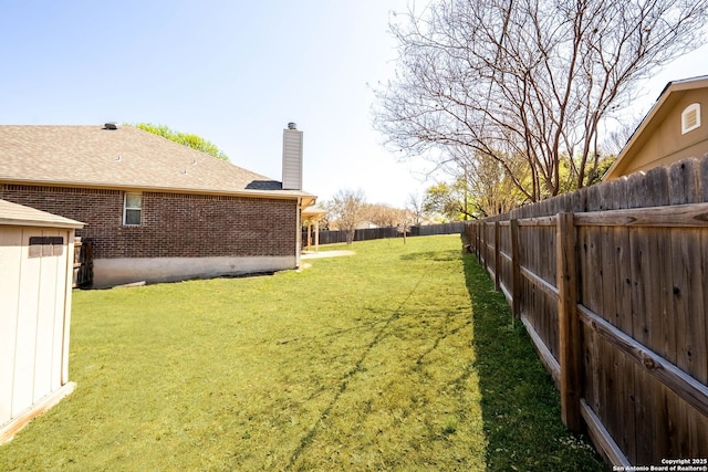 view of yard featuring a fenced backyard