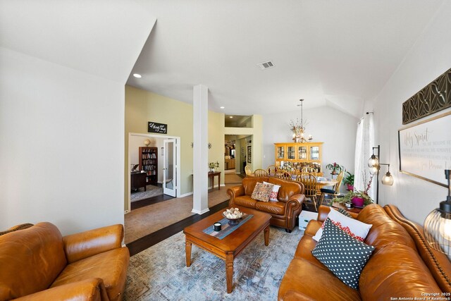 living area featuring recessed lighting, wood finished floors, a chandelier, visible vents, and lofted ceiling