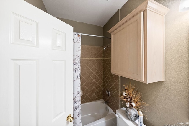 bathroom with shower / bathtub combination with curtain