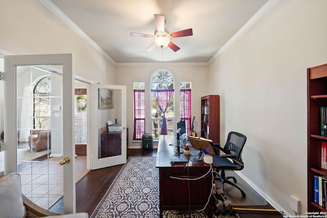 office space featuring ornamental molding, a ceiling fan, a wealth of natural light, and wood finished floors