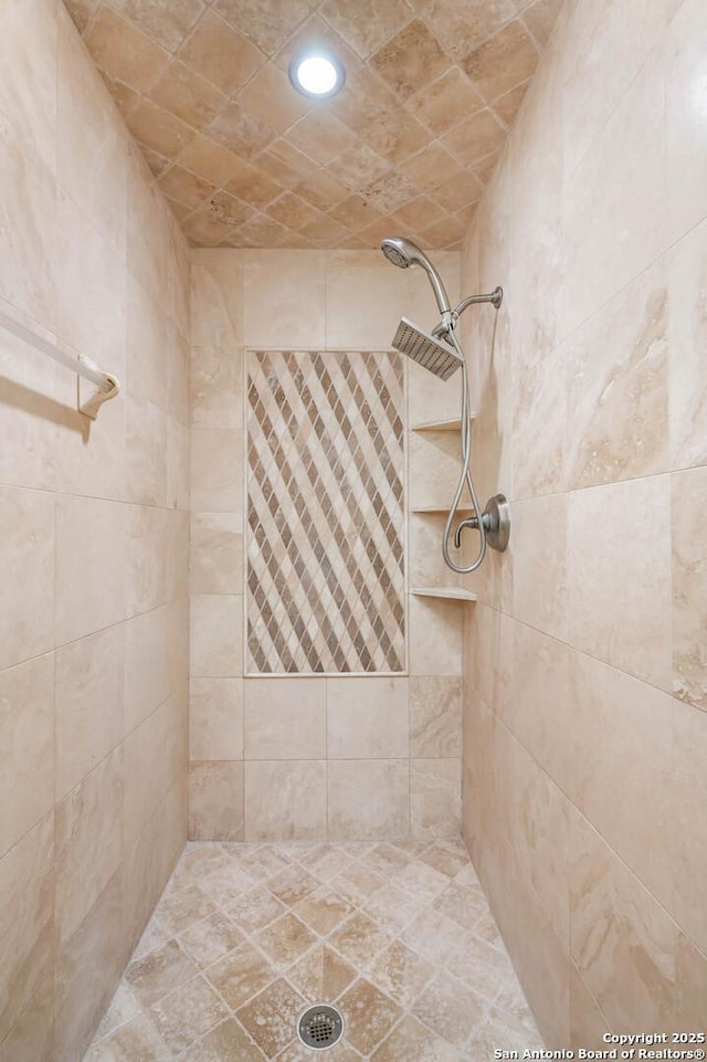 full bath with recessed lighting and a tile shower