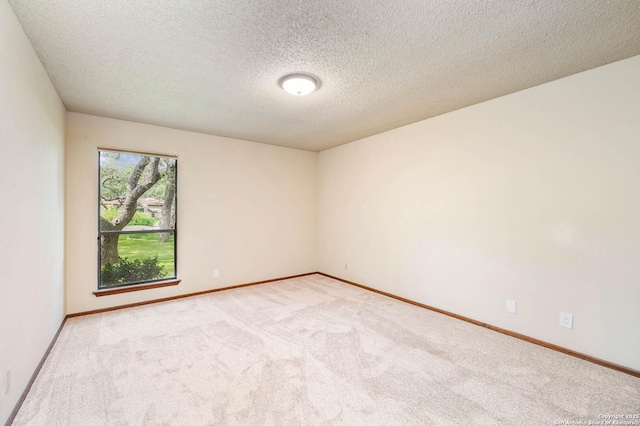 empty room with carpet floors and baseboards
