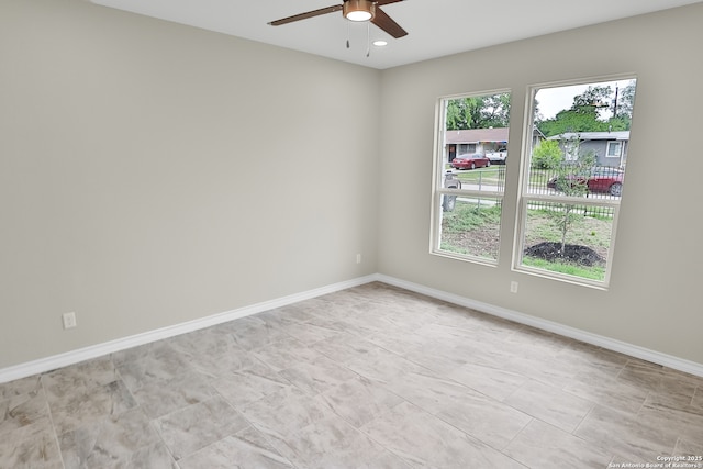 spare room featuring recessed lighting, ceiling fan, and baseboards
