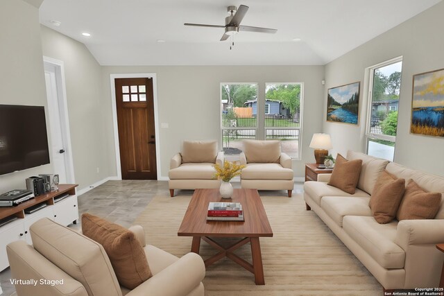 living room with recessed lighting, a ceiling fan, lofted ceiling, and baseboards