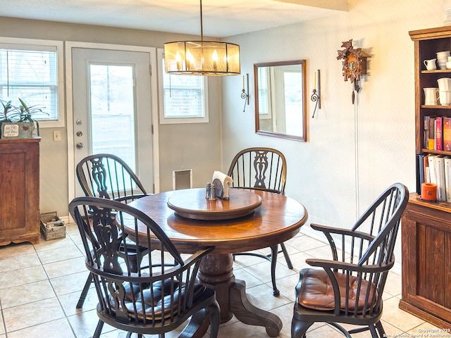 702 Schubert, Fredericksburg, TX 78624 - dining room with an inviting chandelier, plenty of natural light, and light tile patterned floors