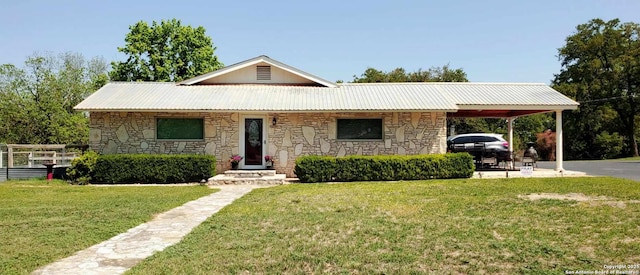 702 Schubert, Fredericksburg, TX 78624 - bungalow with metal roof, a front yard, stone siding, and a carport