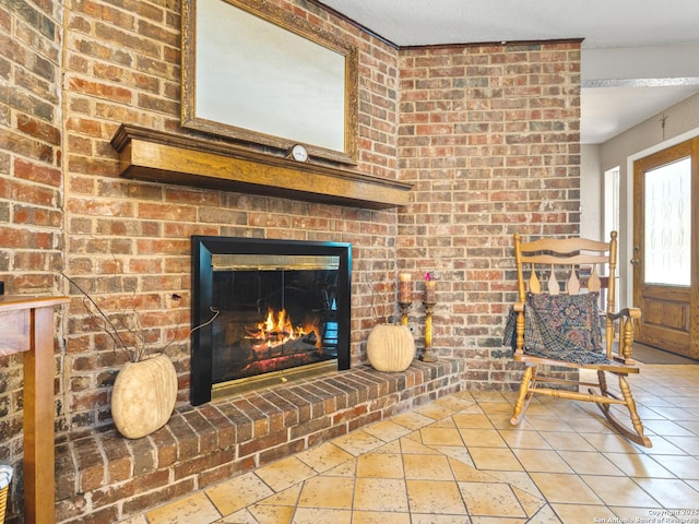 living room featuring stone tile floors and a brick fireplace