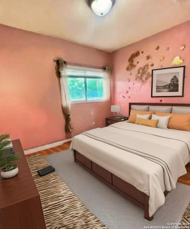 bedroom featuring wood finished floors