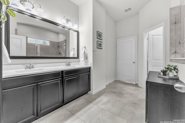 full bathroom featuring visible vents, a sink, double vanity, and tiled shower