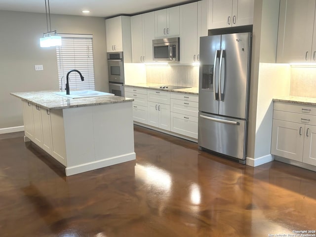 kitchen with baseboards, tasteful backsplash, stainless steel appliances, and a sink