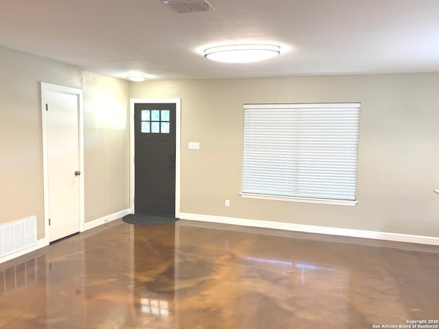 entryway with baseboards and visible vents