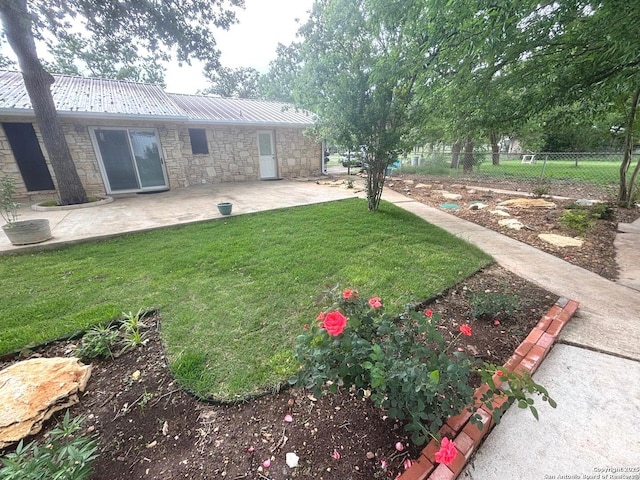 view of yard featuring a patio and fence