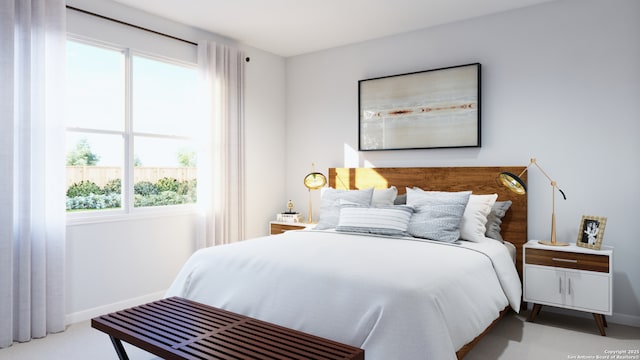 bedroom featuring baseboards and carpet flooring