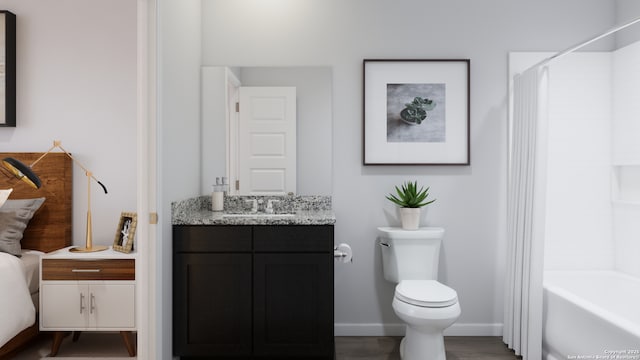 full bathroom featuring wood finished floors, shower / bath combo, toilet, vanity, and baseboards