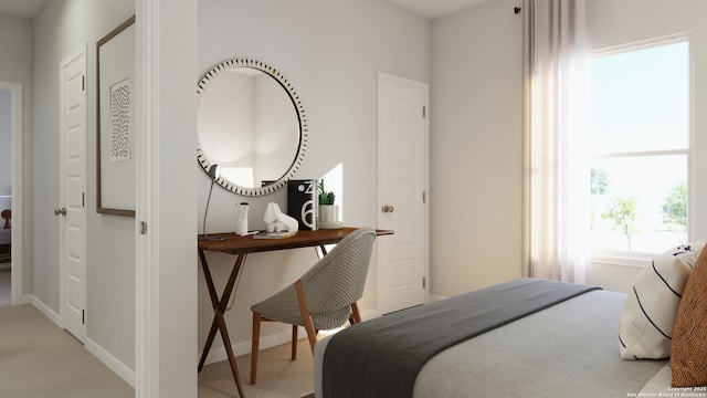bedroom featuring baseboards and light colored carpet