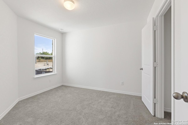 4770 Pico Pico St, San Antonio, TX 78222 - carpeted empty room featuring baseboards