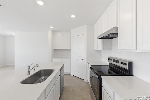 4770 Pico Pico St, San Antonio, TX 78222 - kitchen with appliances with stainless steel finishes, under cabinet range hood, a sink, white cabinets, and light countertops