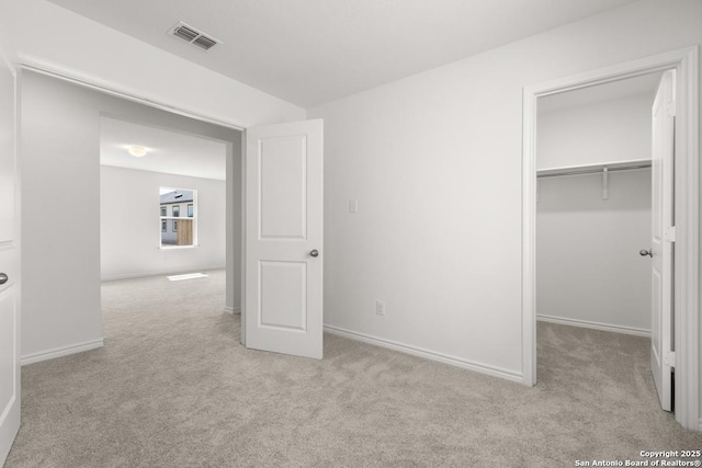 4770 Pico Pico St, San Antonio, TX 78222 - unfurnished bedroom with carpet floors, a spacious closet, baseboards, and a closet