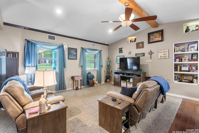 living area featuring visible vents, ceiling fan, vaulted ceiling with beams, and baseboards