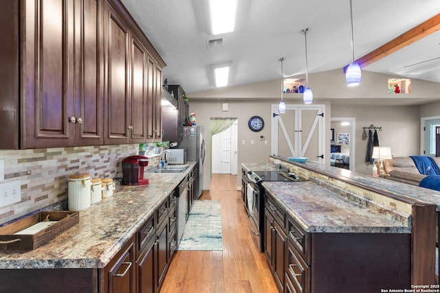 kitchen featuring visible vents, appliances with stainless steel finishes, lofted ceiling, and tasteful backsplash