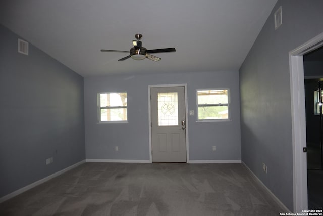 97 Segner, Fredericksburg, TX 78624 - foyer entrance with healthy amount of natural light, a ceiling fan, carpet floors, and baseboards