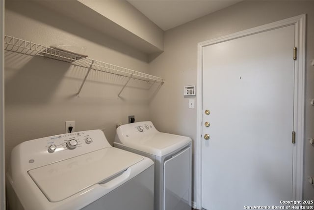 clothes washing area featuring laundry area and washing machine and dryer