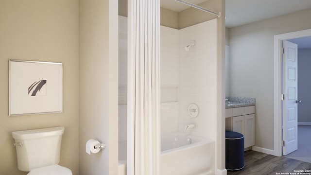 full bath with toilet, vanity, wood finished floors, and  shower combination
