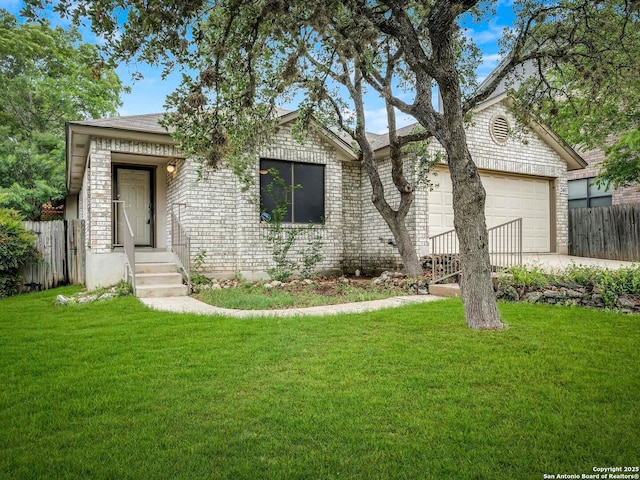 single story home featuring a front lawn, a garage, driveway, brick siding, and fence