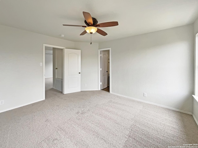 unfurnished bedroom with baseboards, ceiling fan, and carpet