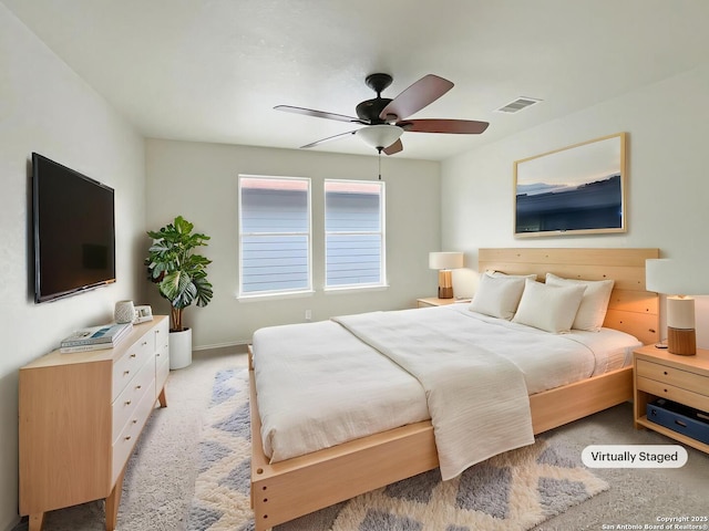 bedroom featuring visible vents, ceiling fan, baseboards, and light carpet