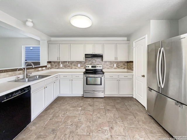 kitchen featuring a sink, decorative backsplash, stainless steel appliances, under cabinet range hood, and light countertops