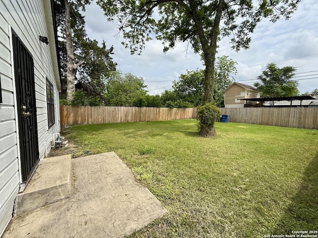 view of yard featuring a patio and a fenced backyard