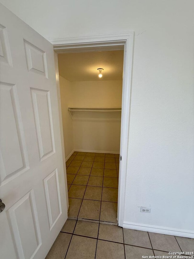 spacious closet featuring tile patterned floors