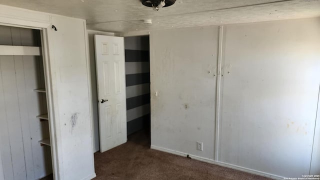 unfurnished bedroom featuring carpet floors and a closet