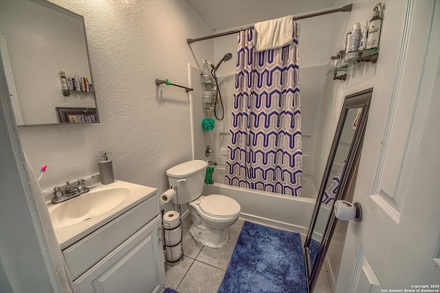 bathroom with tile patterned flooring, shower / bath combo, toilet, a textured wall, and vanity