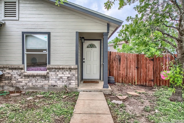 property entrance with fence