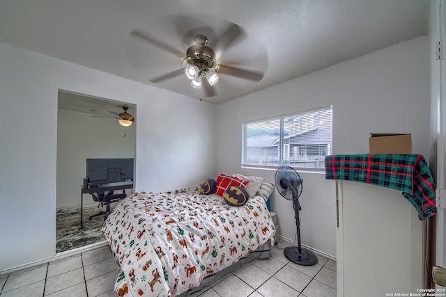bedroom featuring light tile patterned flooring and ceiling fan