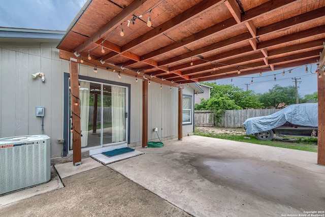 view of patio with fence and central air condition unit
