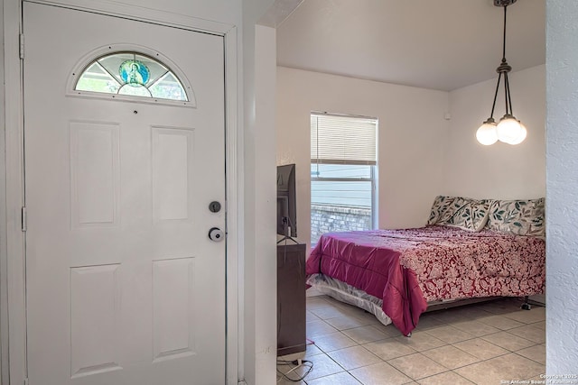 bedroom featuring light tile patterned flooring